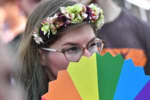 People take part in the lesbian, gay, bisexual and transgender (LGBT) Pride Parade in front of the parliament building in Budapest downtown in the Hungarian capital on July 6, 2019.