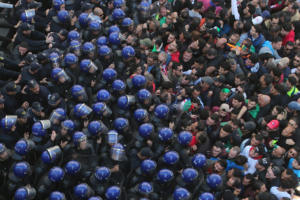 Police officers and protesters confront each other during a demonstration to mark the first anniversary of protests that ousted President Abdelaziz Bouteflika, in Algiers, Algeria February 22, 2020. REUTERS/Ramzi Boudina