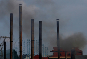 Smoke rises from the chimney of a paper factory outside Hanoi, Vietnam May 21,