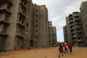Displaced children walk between unfinished buildings in Tripoli, Libya January 16, 2020. REUTERS/Ismail Zitouny