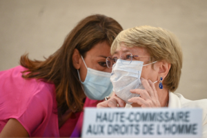 United Nations High Commissioner for Human Rights Michelle Bachelet (R) wearing a facemask as a preventive measure against the Covid-19 coronavirus speaks with an assistant during a special session of the UN Human Rights Council on Afghanistan in Geneva on August 24, 2021. - The UN rights chief voiced grave concern at the situation in Afghanistan after the Taliban swept into power, saying their treatment of women would mark a "fundamental red line". The UN Human Rights Council discuss the text during a special session requested just days after the Taliban took effective control of Afghanistan on August 15. (Photo by Fabrice COFFRINI / AFP)