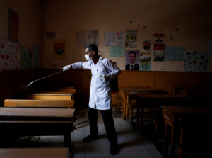 A worker sanitises schools as part of the preventive measures against the spread of the coronavirus disease (COVID-19), in Damascus, Syria March 18, 2020. REUTERS/Omar Sanadiki