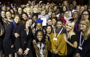 Event participants gather together with German Chancellor Angela Merkel for a group photo during the international W20 Summit in Berlin, Germany, 26 April 2017. Photo: Odd Andersen/AFP POOL/dpa