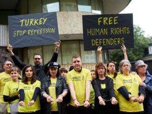AI France staff membres protesting the arrest and detention of AI Turkey director Idil Eser, AI Turkey chairman Taner Kiliç and 9 orhers Human rights defenders at the Turkish embassy in Paris on 10 July 2017.