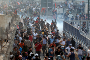 Demonstrators disperse as Iraqi Security forces use tear gas during a protest against government corruption amid dissatisfaction at lack of jobs and services at Tahrir square in Baghdad, Iraq October 1, 2019. REUTERS/Thaier Al-Sudani