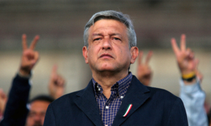 Andres Manuel Lopez Obrador, presidential candidate of the Party of the Democratic Revolution (PRD), looks at his supporters in central Zocalo Square, Mexico City August 5, 2006. Obrador angrily vowed to push ahead with street protests that have paralyzed the capital after a top court on Saturday rejected his demand for a full recount in a presidential vote he says was stolen from him. REUTERS/Tomas Bravo (MEXICO)
