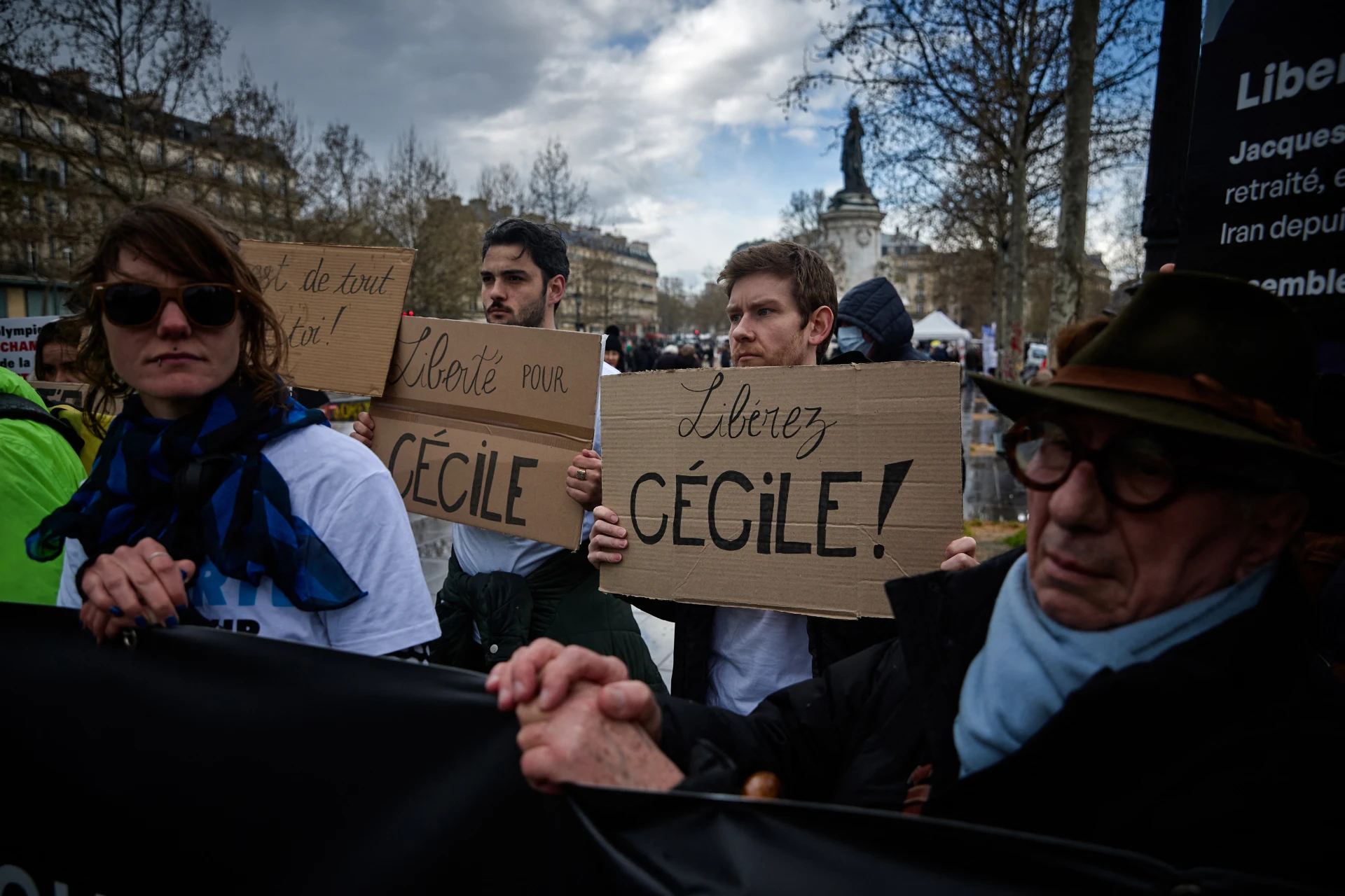 People, holding placards which read as "Free Cecile", "Freedom for Cecile", for French teacher Cecile Kohler detained in Iran since May 2022, take part in a rally at Place de la Republique in Paris on March 23, 2024, to support and ask for the release of the four French citizens held in Iran. Foreign nationals are being held by Tehran in what activists and Western governments have described as a deliberate hostage-taking strategy aimed at extracting concessions from the West.
KIRAN RIDLEY / AFP
