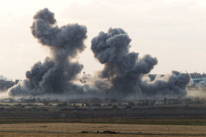 Smoke rises from Gaza after an explosion, as seen from the Israeli side of the border, April 14, 2025