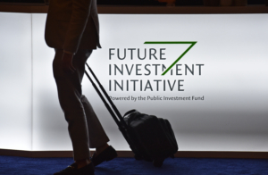 A delegate arrives at the King Abdulaziz Conference Centre in Saudi Arabia's capital Riyadh to attend the Future Investment Initiative (FII) forum on October 29, 2019. - Top finance moguls and political leaders were expected at a Davos-style Saudi investment summit in stark contrast to last year when outrage over critic Jamal Khashoggi's murder sparked a mass boycott. Organisers say 300 speakers from over 30 countries, including American officials and heads of global banks and major sovereign wealth funds, are attending the three-day forum. (Photo by FAYEZ NURELDINE / AFP)