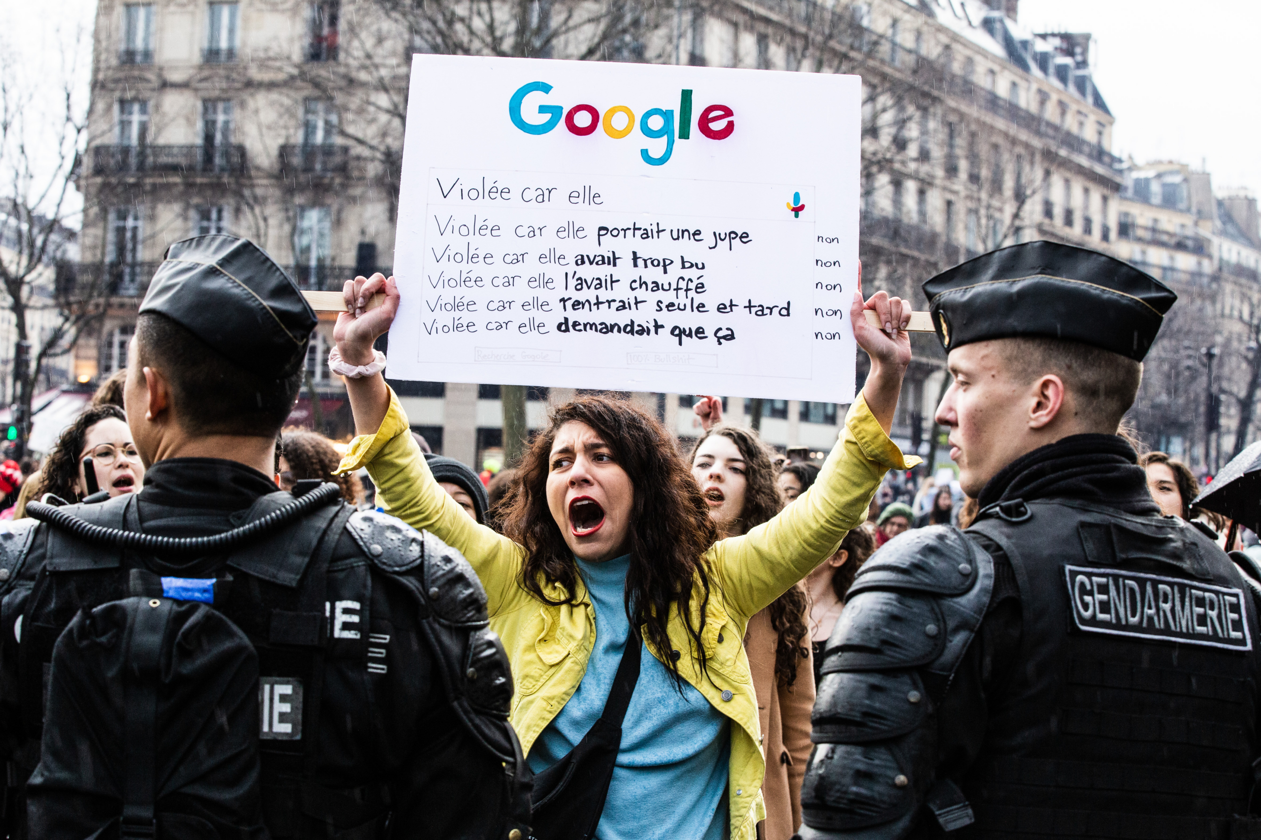 A protester holds a sign with a google search with the reasons for a rape. Feminist demonstration on 8 March 2020 in Paris for the international day of struggle for women s rights, under the rallying cries "Great winners", "We all stop". Paris, France, Sunday, March 08, 2020.