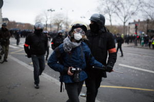 A journalist arrested by police forces at the arc de triomphe during anti-government demonstration called by the Yellow Vest (Gilets Jaunes) movement in Paris on January 12, 2019. France braced for a fresh round of "yellow vest" protests across the country on with the authorities vowing zero tolerance for violence after weekly scenes of rioting and vandalism in Paris and other cities over the past two months. Photo by Raphael Lafargue/ABACAPRESS.COM
