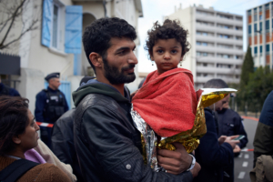 A family living in the squat wait in the streets to know where they will sleep. A blaze happened in one of the wings of the biggest squat in Toulouse: the 'Squat Russel'. More than 500 people lived there before the blaze. They left nearly all their belongings in the building. There were no casualties People from the squat came from West Africa, Albania, Bulgaria, etc.