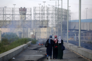 Palestinian protestors walk towards the border during a demonstration at the Erez crossing with Israel on September 18, 2018, in the northern Gaza Strip. - Israel has maintained a siege on Gaza for a decade which it says is necessary to limit Hamas, the Islamist movement that runs the strip and with which it has fought three wars since 2008. Photo by SAID KHATIB / AFP