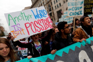Students participate in the 'Our Generation, Our Choice' protest in downtown Washington November 9, 2015. The Monday march to highlight race, climate, and immigration issues was timed to mark exactly one year until the 2016 U.S. presidential election.  REUTERS/Jonathan Ernst