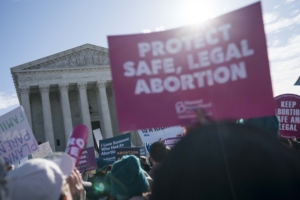 WASHINGTON, DC - MARCH 04: People participate in an abortion rights rally outside of the Supreme Court as the justices hear oral arguments in the June Medical Services v. Russo case on March 4, 2020 in Washington, DC. The Louisiana abortion case is the first major abortion case to make it to the Supreme Court since Donald Trump became President. Sarah Silbiger/Getty Images/AFP 
Sarah Silbiger / GETTY IMAGES NORTH AMERICA / Getty Images via AFP